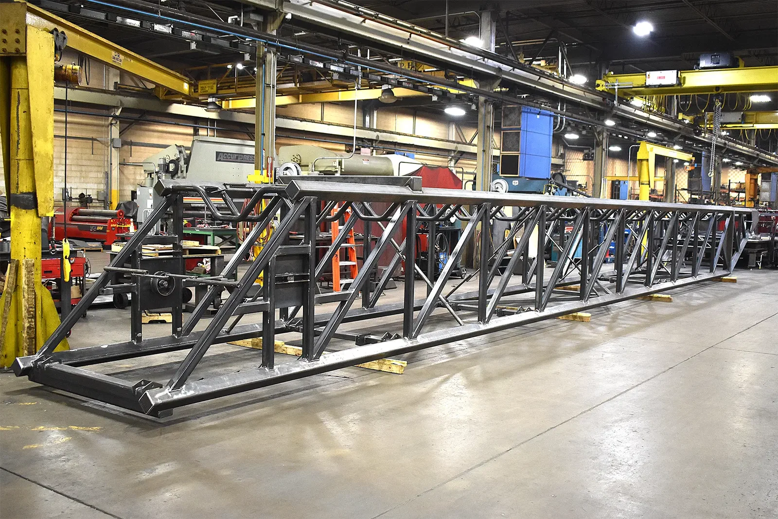 Completed telescopic conveyor extendable rail staged for shipping at Cutting Edge Fabrication.