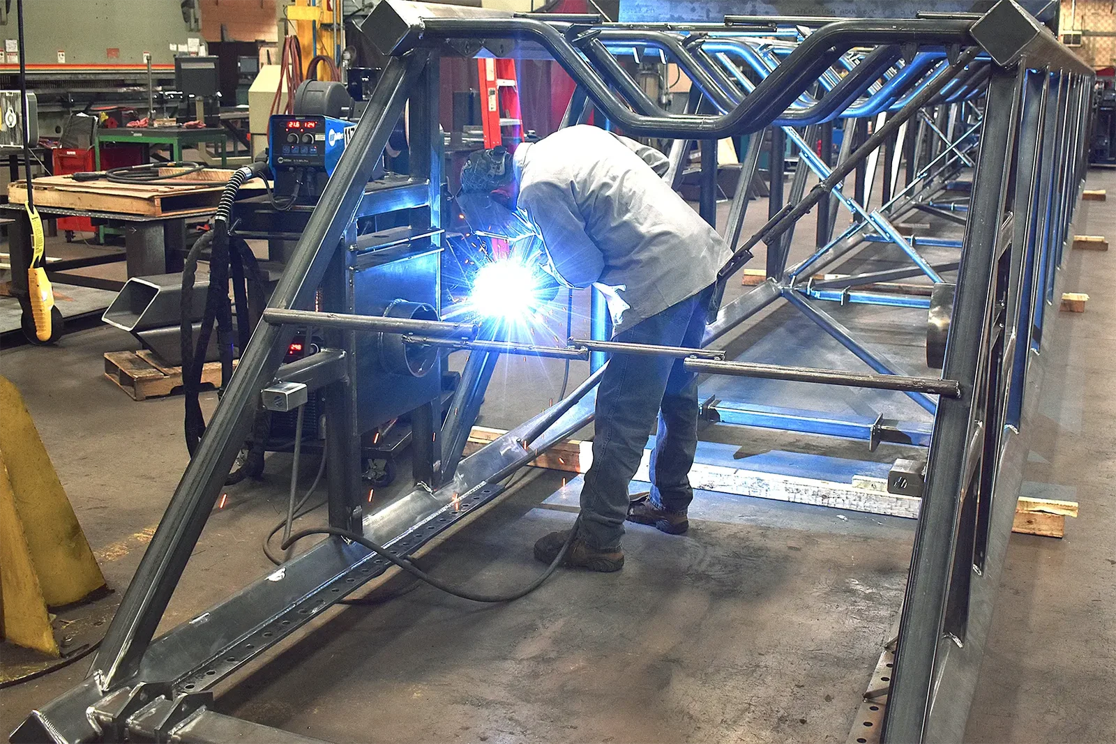 MIG welding fabrication of telescopic conveyor rail at Cutting Edge Fabrication.